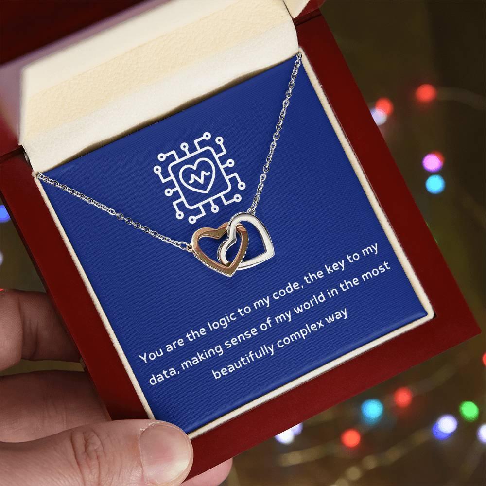 Give her the gift that symbolizes your never-ending love. Featuring two lovely hearts embellished with cubic zirconia crystals, this Interlocking Hearts necklace is the perfect accessory for everyday wear. Whether it's a memorable anniversary or a special