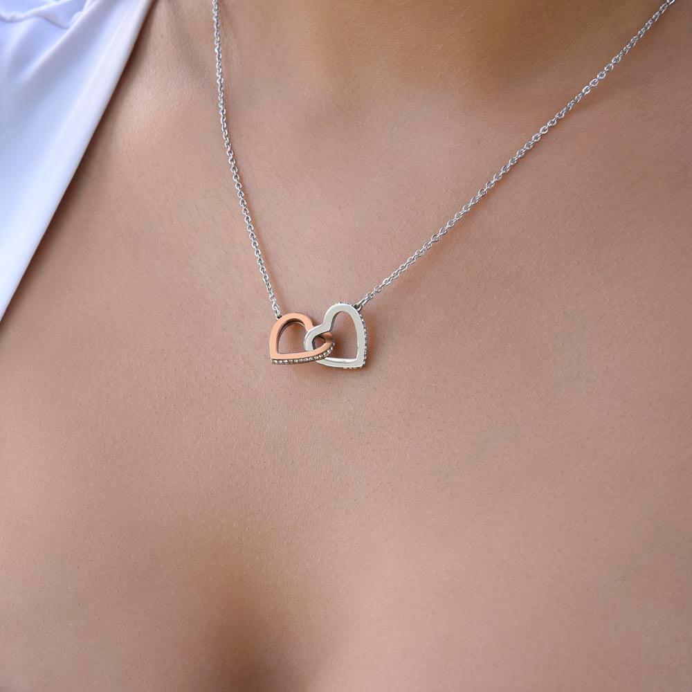 Give her the gift that symbolizes your never-ending love. Featuring two lovely hearts embellished with cubic zirconia crystals, this Interlocking Hearts necklace is the perfect accessory for everyday wear. Whether it's a memorable anniversary or a special