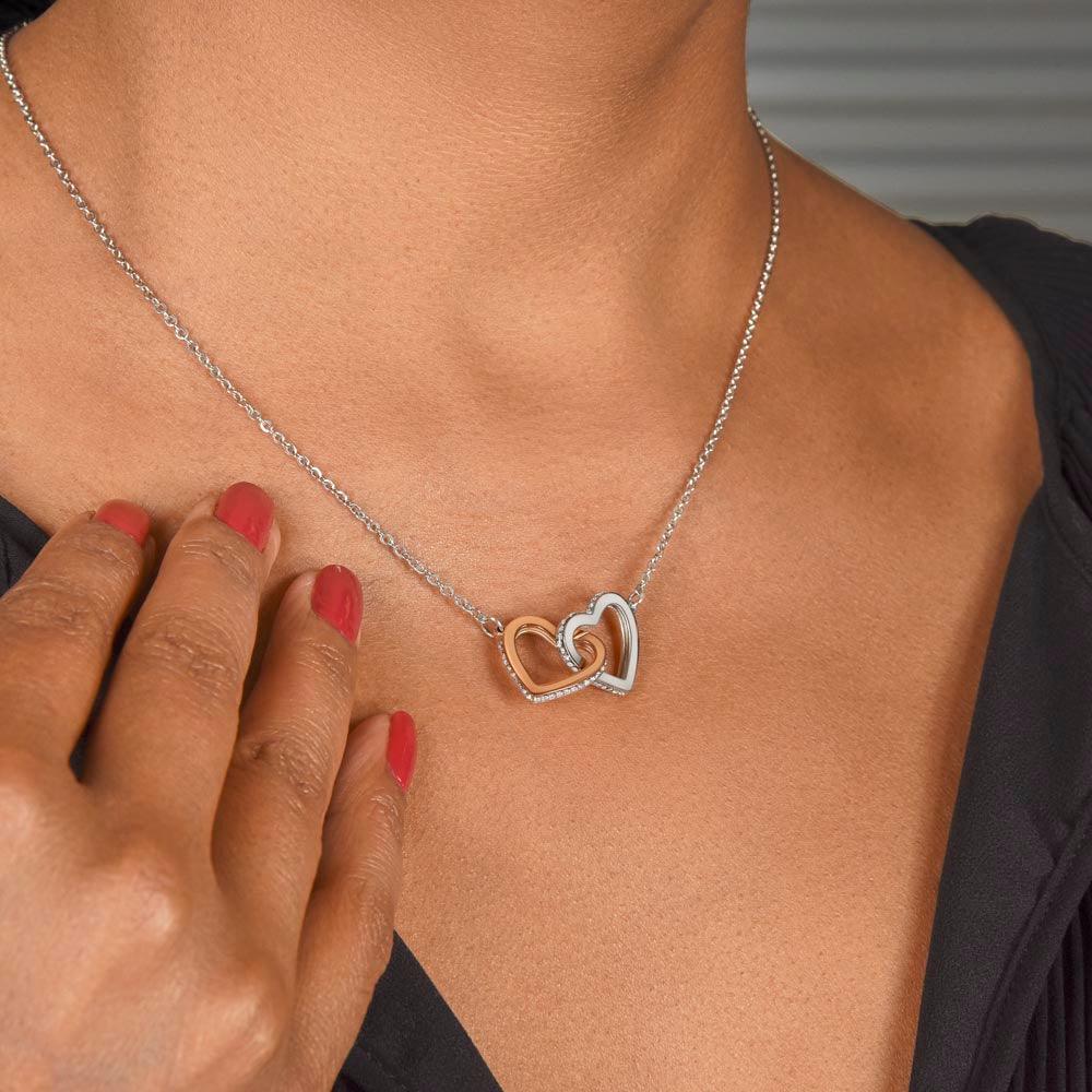 Give her the gift that symbolizes your never-ending love. Featuring two lovely hearts embellished with cubic zirconia crystals, this Interlocking Hearts necklace is the perfect accessory for everyday wear. Whether it's a memorable anniversary or a special